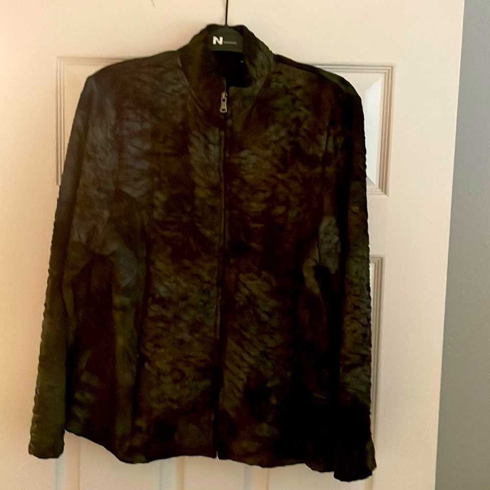 Short multi colored jacket that zips down the front.